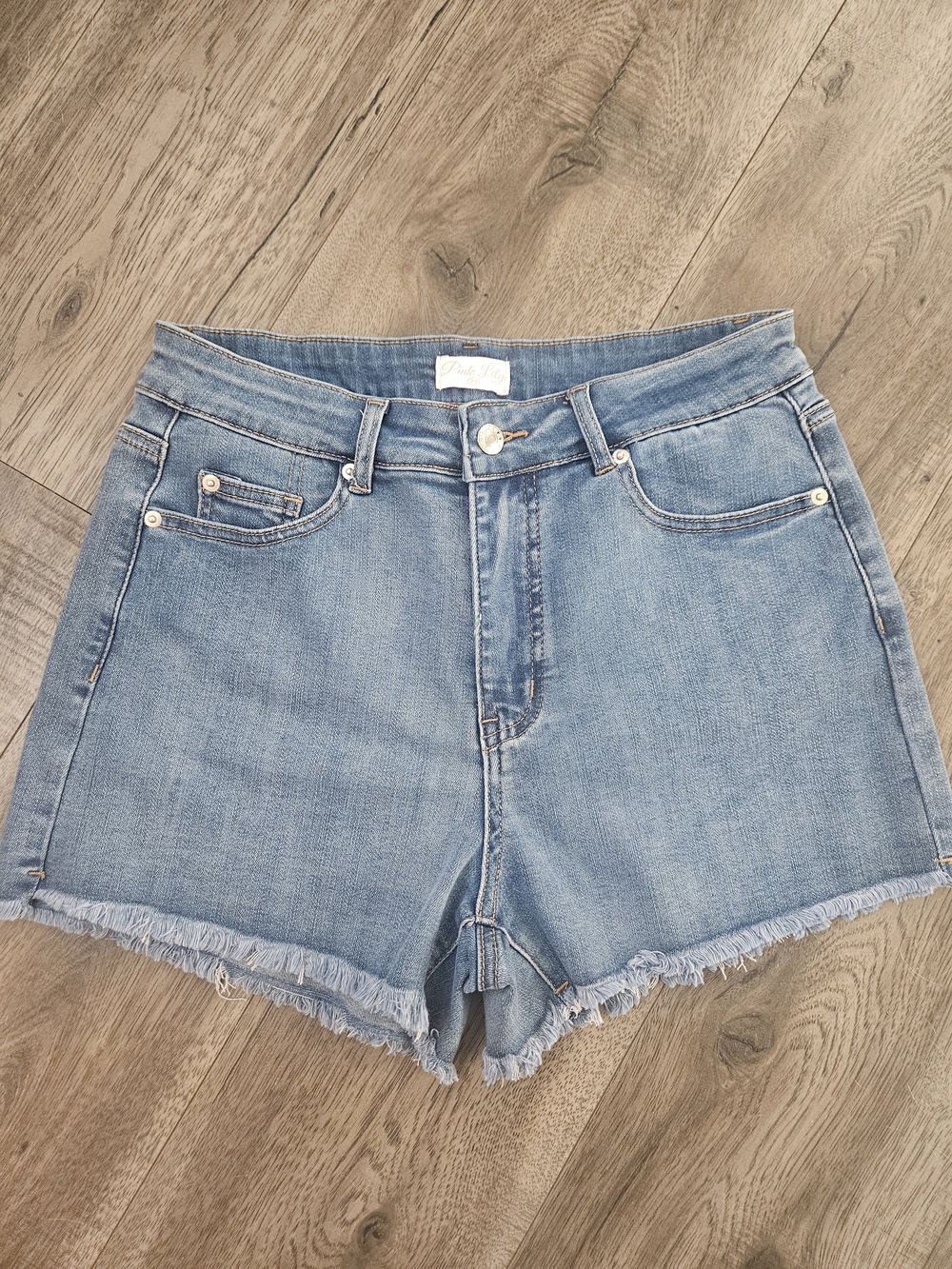 Pink Lily Medium Wash Denim Shorts with Frayed Hem